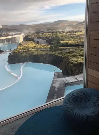  ??  ?? AMAZING VIEWS: Guests can enjoy a stunning view from a suite at the Retreat at the Blue Lagoon in Iceland. The resort’s Lava Restaurant, below, is built down into the lava, making for great dining views. At left, the church at Hvalsnes overlooks a small seaside town.