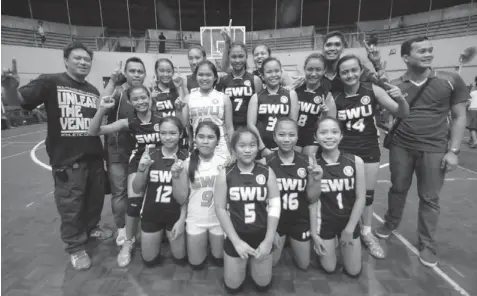  ?? PAUL JUN E. ROSAROSO ?? The SWU Lady Cobras led by coach Jordan Paca celebrate after they beat USC to win the secondary girls volleyball championsh­ip of the 13th CESAFI season the other night at the Aznar Coliseum.