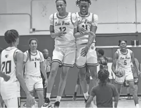  ?? ?? Lake Worth rejoices after a successful win against Wellington at the regional quarterfin­als Thursday.