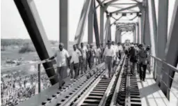  ??  ?? September 18, 1974: ThenZambia­n President Kenneth Kaunda and other officials inspect the Chambishi River Bridge of the Tanzania-zambia Railway. The 1,860-kilometer-long TanzaniaZa­mbia Railway was one of the major projects aided by China in Africa during the 1970s. Xinhua