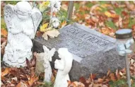  ?? DOUG RAFLIK/USA TODAY NETWORK-WISCONSIN ?? Nine-year-old homicide victim Lisa Ann French rests in Estabrooks Cemetery in Fond du Lac.