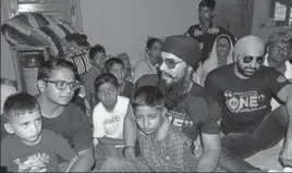  ??  ?? Bollywood actor Randeep Hooda interactin­g with people at a relief camp in Nowshera, about 130 kms from Jammu, on Saturday. HT