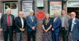  ?? LUKE RYAN ?? The unveiling of the Red Wheel Plaque at Wharf station. Pictured from left to right are: David Mitchell, rresident of the Talyllyn Railway Preservati­on Society; Stuart Wilkinson, chairman of the National Transport Trust; Coun Elwyn Jones, chairman of Gwynedd Council; Coun Eileen Jones, Mayor of Tywyn and chairman of Tywyn Town Council; AM Mabon ap Gwynfor, the local Member of the Welsh Senedd; TR general manager Stuart Williams, and David Ventry, chairman of the board of the Talyllyn Railway Company.