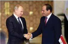  ?? EPA ?? Abdel Fattah El Sisi, right, and Vladimir Putin shake hands on their Egypt-Russia nuclear power plant deal