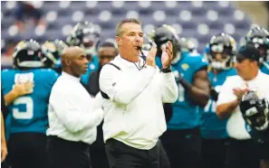  ?? The Associated Press ?? Jacksonvil­le Jaguars coach Urban Meyer blows his whistle before an NFL game against the Houston Texans Sunday in Houston.