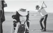  ?? JULIE JACOBSON/THE ASSOCIATED PRESS ?? A doll hangs off the golf bag of Bubba Watson as he hits off the practice range for the Match Play Championsh­ip.