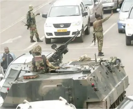  ?? (Picture by Reuters) ?? FILE PHOTO: Military vehicles and soldiers patrol the streets in Harare.