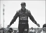  ?? TRIBUNE NEWS SERVICE ?? NASCAR driver Jimmie Johnson celebrates with fans during driver introducti­ons before the start of the Toyota/Save Mart 350 at Sonoma Raceway in Sonoma on June 24, 2018.