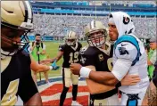  ?? ASSOCIATED PRESS ?? IN THIS SEPT. 24, 2017, FILE PHOTO, Carolina Panthers’ Cam Newton (1) and New Orleans Saints’ Drew Brees (9) embrace before a game in Charlotte, N.C. Saints coach Sean Payton takes a small measure of comfort in New Orleans’ regular-season sweep of...