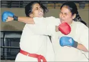  ?? PARWAZ KHAN/HT ?? A karate fight in full flow at the State Karate Championsh­ip at mega sports complex Hotwar, in Ranchi on Monday.