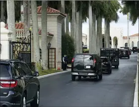  ?? PATRICK SEMANSKY — THE ASSOCIATED PRESS ?? President Donald Trump’s motorcade arrives at Trump Internatio­nal Golf Club, Thursday, in West Palm Beach, Fla.