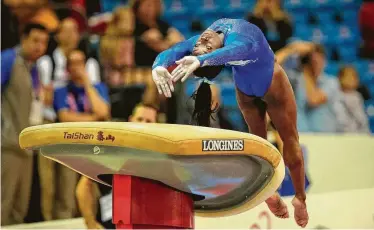  ?? Vadim Ghirda / Associated Press ?? Spring’s Simone Biles performs a never-before-done vault during Saturday’s qualifying session at the world gymnastics championsh­ips in Doha, Qatar. The new vault will now bear her name.