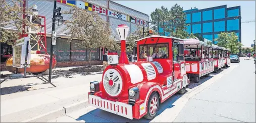  ?? THE CHRONICLE HERALD ?? The Waterfront Road Train on Lower Water Street in Halifax sits in front of the Maritime Museum of the Atlantic last week. The new, three-carriage road train provides a free ride along the Halifax waterfront.