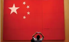  ?? Photograph: Noel Celis/AFP/Getty Images ?? The national flag on show at the Museum of the Communist Party of China in Beijing. The capital will see a crucial Congress meeting this weekend that will see the party gain closer control of government.