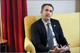  ?? KATHERINE FREY — THE WASHINGTON POST VIA AP ?? Virginia Gov. Ralph Northam talks during an interview at the Governor’s Mansion, Saturday in Richmond, Va. The embattled governor says he wants to spend the remaining three years of his term pursuing racial “equity.” Northam told The Washington Post that there is a higher reason for the “horrific” reckoning over a racist photograph that appeared in his medical school yearbook.