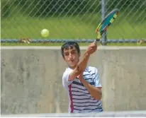  ?? RICK KINTZEL/THE MORNING CALL ?? Liberty’s Roman Farhad returns a serve during the 2022 District 11 2A and 3A doubles tennis semifinals at Parkland High School. Farhad went undefeated this season and will be one of the favorites in the District 11 Class individual tennis tournament which is next week.