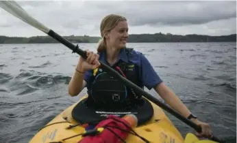  ?? LIZ BEDDALL ?? Guide Hilary Munro leads visitors in intimate and informativ­e kayak adventures in Rotorua, New Zealand.