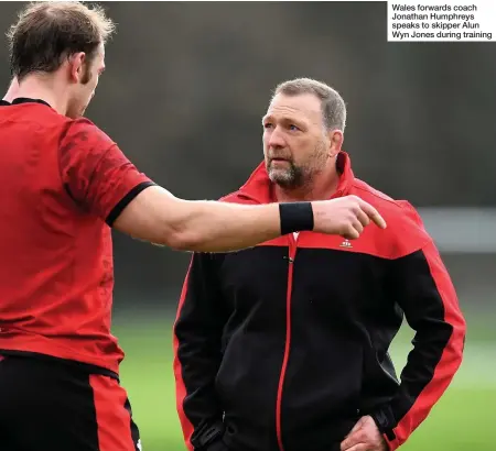  ??  ?? Wales forwards coach Jonathan Humphreys speaks to skipper Alun Wyn Jones during training