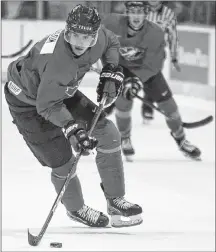  ?? CP PHOTO ?? Canada’s Brett Leason looks for an open man during first period action against U Sports at the Q Centre in Colwood, B.C., on Wednesday.