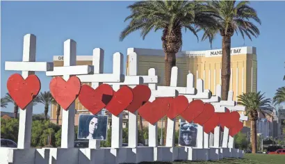  ?? TOM TINGLE/USA TODAY NETWORK ?? Artist Greg Zanis of Aurora, Ill., installed crosses to honor those killed in Las Vegas.