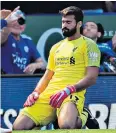  ??  ?? On his knees: Alisson shows remorse after being dispossess­ed for Leicester’s goal