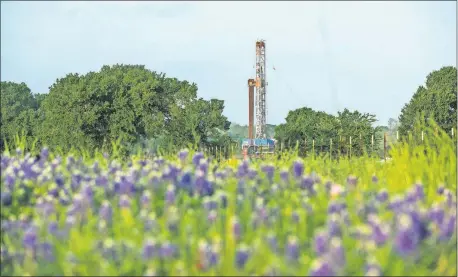  ?? ARCHIVES] [THE OKLAHOMAN ?? A rig drills a well within Chesapeake Energy's Brazos Valley operationa­l area in the Texas Eagle Ford Shale field in April 2019.