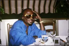  ?? JOEL ROBINE, STF/AFT VIA GETTY IMAGES ?? Miles Davis in a Nice restaurant after performing at the Grand Parade Jazz Festival in July 1985.