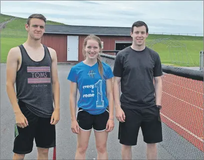  ?? ADAM MACINNIS/THE NEWS ?? Pictou County Athletics Track & Field Club will be hosting an elementary track meet later this month. Helping to organize the event are summer workers Logan Coulet, Megan Graham and Ryan Washburn.