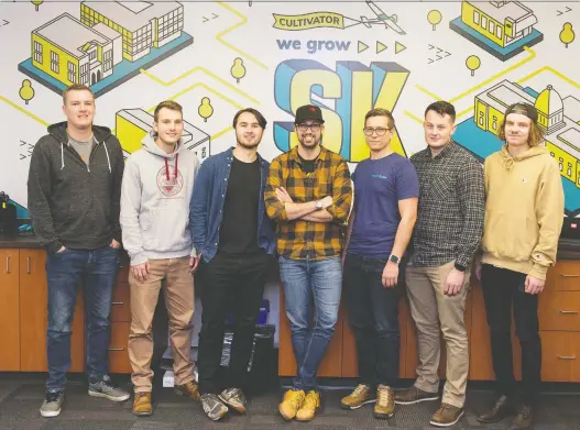  ?? PHOTOS: BRANDON HARDER ?? CEO Kirk Morrison, centre, with the Krugo team in a common area at the Cultivator workspace on Research Drive next to the University of Regina.