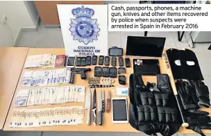  ??  ?? Cash, passports, phones, a machine gun, knives and other items recovered by police when suspects were arrested in Spain in February 2016