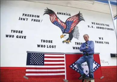  ?? The Sentinel-Record/Grace Brown ?? NEW MURAL: Artist Gary George with the mural he created for the new Hot Springs VFW Post 2278, which opened July 1.