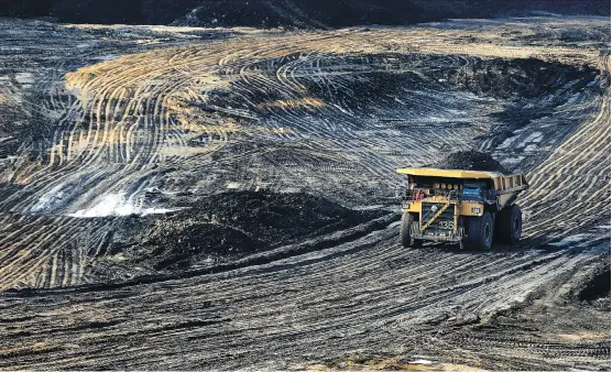  ?? JULIA KILPATRICK/WWW.PEMBINA.ORG ?? A heavy hauler truck makes its way across the Shell Albian Sands’ Jackpine mine, north of Fort McMurray. “I think it’s safe to say that we’re not looking at a return to booming growth,” said Michael Burt of the Conference Board of Canada. Still, a...