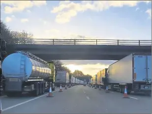  ?? Picture: Kent Police RPU ?? Lorries queuing on the M20 heading coastbound