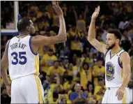  ?? AP/JEFF CHIU ?? Golden State forward Kevin Durant (left) celebrates with guard Stephen Curry after their NBA Western Conference final opener against San Antonio on Sunday. Curry finished with 40 points as the Warriors erased a 25-point deficit to beat the Spurs 113-111.