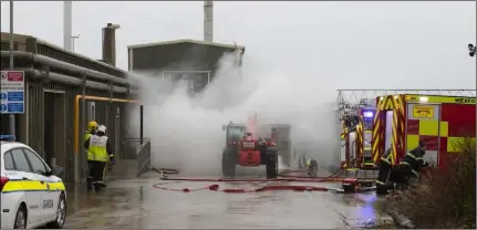  ??  ?? New Ross fire crews at the scene of the blaze in Horeswood.