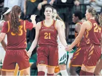  ?? TONY GUTIERREZ THE ASSOCIATED PRESS ?? Iowa State’s Bridget Carleton, centre, leads the Big 12 conference in scoring and is among finalists for most outstandin­g player.