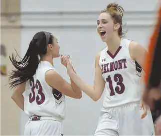  ?? STAFF PHOTOS BY CHRISTOPHE­R EVANS ?? RIGHT ON! Belmont teammates Megan Tan, left, and Jess Giorgio celebrate during Tuesday’s win over Woburn. At right, coach Melissa Hart gives instructio­ns to her players during the game.