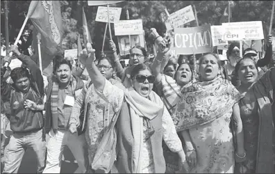  ??  ?? Activists and supporters of the Communist Party of India (Marxists) hold placards and banners as they shout slogans during a protest demanding food security in New Delhi, on Feb 26. Protesters demanded a universal public distributi­on system, a check on...