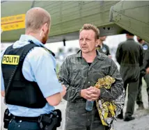  ?? REUTERS ?? Danish ‘‘inventrepr­aneur’’ Peter Madsen is interviewe­d by police after being rescued from his sinking submarine.