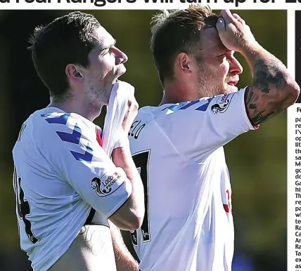  ??  ?? Double dejection: Ryan Kent (left) and Scott Arfield trudge off after the shock defeat to Livingston