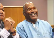  ?? AP POOL PHOTO ?? Former NFL football star O.J. Simpson laughs as he appears via video for his parole hearing at the Lovelock Correction­al Center in Lovelock, Nev., on Thursday. Simpson was granted parole after more than eight years in prison for a Las Vegas hotel...