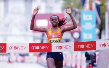  ?? File / Reuters ?? ↑ Kenya’s Brigid Kosgei celebrates as she wins the elite women’s race of the London Marathon.