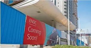  ?? — Photos by M. Sajjad ?? A sign board on one of the two closed Enoc petrol stations reads ‘Coming Soon!’ in Sharjah.