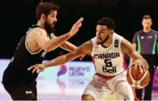  ?? RONALDO SCHEMIDT/AFP/GETTY IMAGES ?? Cory Joseph, right, watched the U.S. Dream Team as a youngster and dreamed about playing in the Olympics for Canada.