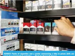  ?? — Photo by Yasser Al-Zayyat ?? KUWAIT: Packs of cigarettes and a poster announcing a hike in prices (left) are seen at a supermarke­t yesterday.