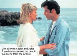  ??  ?? Olivia Newton John and John Travolta embrace on the beach in a scene from the Grease