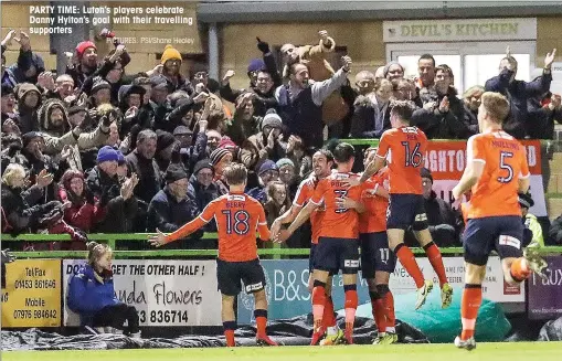  ?? PICTURES: PSI/Shane Healey ?? PARTY TIME: Luton’s players celebrate Danny Hylton’s goal with their travelling supporters