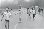  ?? ASSOCIATED PRESS ?? Phan Thi Kim Phuc (center), 9, runs naked and severely burned after a napalm attack in South Vietnam in 1972.