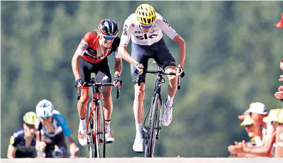  ??  ?? On the rise: Chris Froome surges towards the finishing line ahead of Australia’s Richie Porte to finish third on the first summit finish of this year’s Tour de France