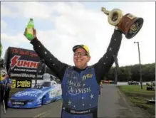  ?? COURTESY NHRA COMMUNICAT­IONS ?? Tommy Johnson Jr. celebrates after winning the Funny Car event Sunday at Maple Grove Raceway.